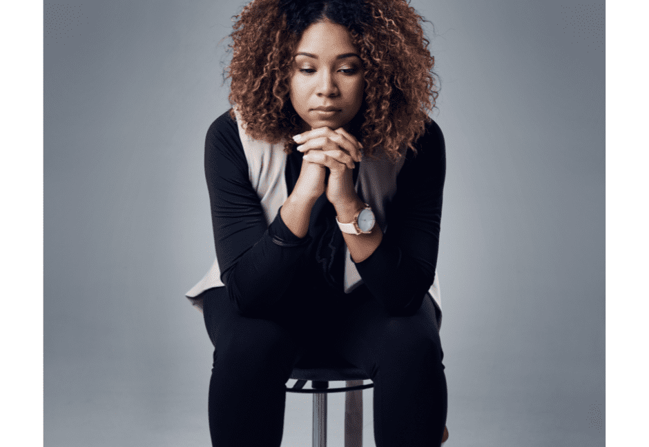 Woman on stool thinking -12 tips to change your mindset and life.